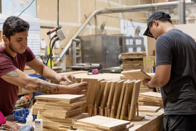 Workers make consumer products from recycled chopsticks at Vancouver-baed ChopValu